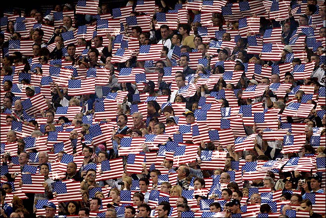 Fans displayed flags during the Super Bowl XXXVIII pregame ceremonies, February 1, 2004.