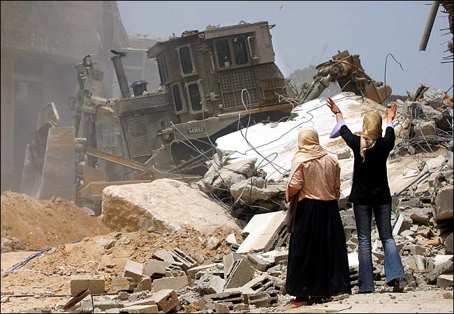 Israeli bulldozers leveled Palestinian homes in the Rafah refugee camp, southern end of the Gaza Strip, May 14, 2004.