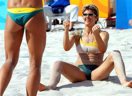 Australia's Natalie Cole reacts after she and teammate Nicole Sanderson, left, eliminated the other Australian team of Summer Lochowicz and Kerri Pottharst in the 2004 Olympic Games at the Olympic Beach Volleyball Centre, Athens, Greece, August 20, 2004.