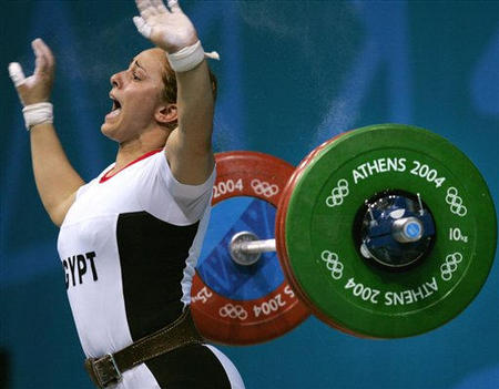 Nahla Ramadan of Egypt yells as she drops the barbell on the clean and jerk during the women's 75 kg event at the Nikaia Olympic Weightlifting Hall during the Summer Olympics in Athens, August 20, 2004.