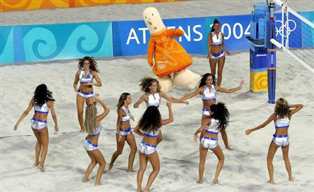 The beach volleybal dancers are joined by the Olympic mascot Athina as they entertain the crowd during the 2004 Olympic Games at the Olympic Beach Volleyball Centre, Athens, Greece, August 18, 2004.