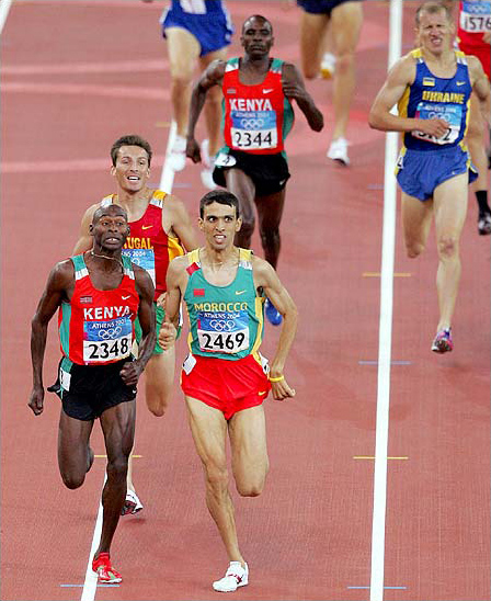 Hicham A-Guerrouj of Morocco defeated Bernard Lagat of Kenya, left, by 0.12 seconds to win the gold medal in the 1,500-meter final at the 2004 Olympic Games, Athens, August 24, 2004.