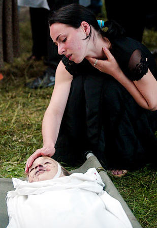 After the siege of the school taken hostage by Islamic militants ended, a mother grieved over her dead child, Beslan, North Ossetia, September 3, 2004.
