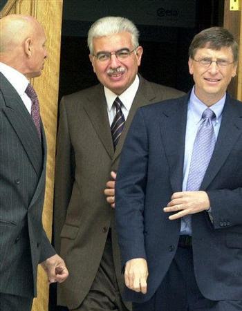 Egyptian communications minister Ahmed Nazif, center, accompanies Microsoft Chairman and world's richest man Bill Gates, following a meeting with Egyptian President Hosni Mubarak, Cairo, January 24, 2004.