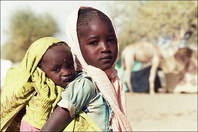 Nijah Ahmed, 4, and her little brother, Nibraz, who is 13 months old and malnourished, are two orphans from Darfur fled to the northern part of the Chad/Sudan border after their parents, uncle and older brother were either killed or went missing in an attack by the Janjaweed militia on their village, Ab-Layha, June 2004.