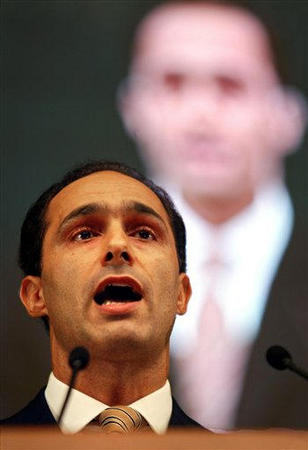 Gamal Mubarak, son of Egyptian president Hosni Mubarak and head of the higher political committee of the ruling National Democratic Party, a policy-making post, speaks at the second annual convention of the NDP while the large monitor behind shows a still image of his, Cairo, Egypt, September 21, 2004