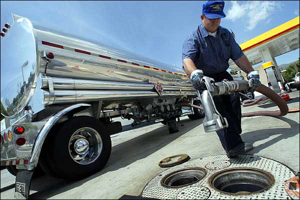 A delivery driver preparing to fill underground tanks in Glendale, California, August 2004.