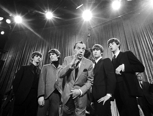 Ed Sullivan, center, stands with The Beatles (from left: Ringo Starr, George Harrison, John Lennon and Paul McCartney), during a rehearsal for the British group's first American appearance, on the Ed Sullivan Show, New York, February 9, 1964.