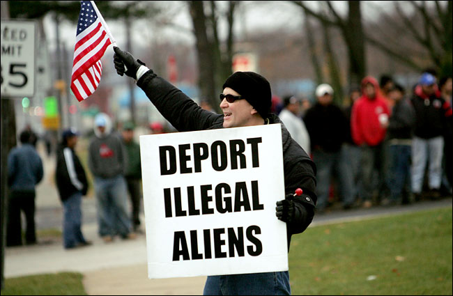 A protester picketing at Horseblock Road and North Ocean Avenue, Farmingville, New York, one of several Long Island communities that have been beset by tensions over an influx of illegal immigrants, November 2004.