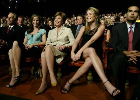 U.S. first lady Laura Bush and her twin daughers Barbara (L) and Jenna (2nd R), along with her nephew George P. Bush (R) watch the third and final presidential candidates debate, at Arizona State University in Tempe, October 13, 2004.