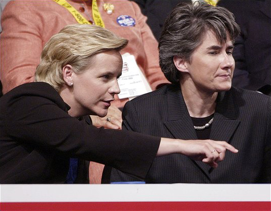 Mary Cheney, left, daughter of Vice President Dick Cheney, sits with partner Heather Poe in Madison Square Garden during the Republican National Convention in New York, September 1, 2004.