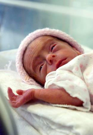 Eliza Maria, daughter of 66-year-old Romanian Adriana Iliescu, is seen in an intensive care unit at the Giulesti Maternity Hospital in Bucharest, Romania, January 17, 2005.