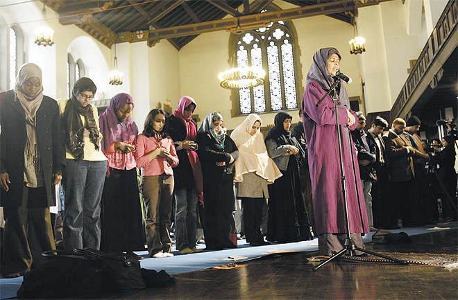 Dr. Amina Wadud, a professor of Islamic studies in Richmond, Virginia, leads the Muslim service after another woman sounded the call to prayer wearing no headscarf and more than a hundred men and women knelt in adjacent rows, with no curtain to divide them, Morningside Heights, Manhattan, New York, March 18, 2005.