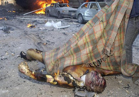 A charred body believed to be for the former Lebanese Prime Minister Rafiq Al-Hariri who was killed in a massive bomb explosion that ravaged his motorcade, Beirut, Lebanon, February 14, 2005.