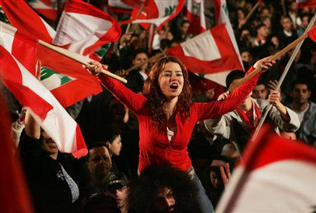 Anti-Syria Lebanese opposition protesters celebrate in an anti-Syria demonstration in Martyr's Square in central Beirut, Lebanon, March 6, 2005, a day after Syrian President Bashar al-Asad announced a Syrian troop pull back from Lebanon.