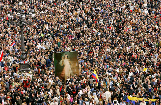 Mourners gather Saint Peter's Square for a solemn mass led by Italian Cardinal Angelo Sodano to pay respect to the death of Pope John Paul II at the Vatican April 3, 2005.
