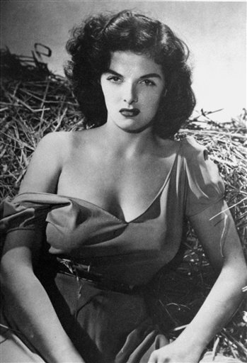 Jane Russell appears at her sultry best in the haystack scene from her screen debut in Howard Hughes's film 'The Outlaw' (1943).