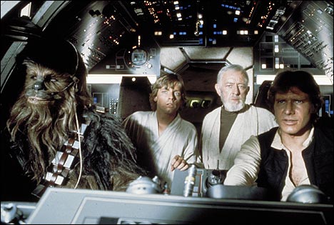 Peter Mayhew as Chewbacca, Mark Hamill as Luke Skywalker and Alec Guinness as Obi-Wan Kenobi watch as Han Solo (Harrison Ford) pilots the Millennium Falcon in 'Star Wars' (1977).