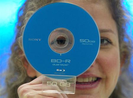 A model displays a prototype of a 50 Gigabyte Blu-Ray DVD by Sony at the CeBIT computer fair in Hanover, Germany, March 9, 2005.