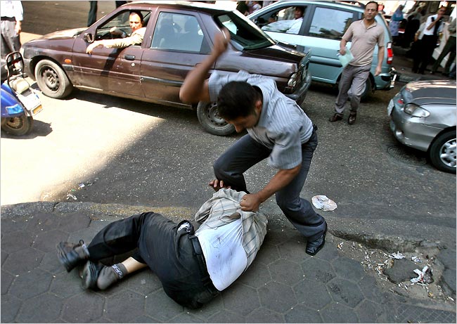 Police in plain clothes silence and beat demonstrators showing support for Islamist judges, Cairo, Egypt, May 11, 2006.