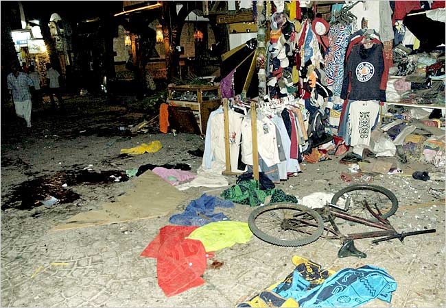 Blood stains the road outside a shop after it was wrecked by a bomb, Dahab, a Sinai resort popular with budget travelers, night of April 24, 2006.
