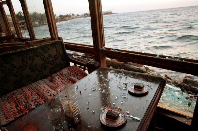 A restaurant bombed a day earlier, is still littered with debris while stunned residents start a cleanup, Dahab, a Sinai resort popular with budget travelers, April 25, 2006.