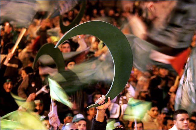 Supporters of the radical Islamic movement Hamas show suport for the group at a campaign rally in the West Bank City of Nablus, January 22, 2006.