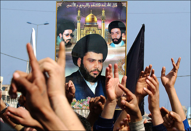 Militiamen loyal to radical cleric Moktada as-Sadr drive through the streets of Sadr City in Baghdad, with Kalashnikovs protesting attacks on the golden-domed shrine in Samarra, February 22, 2006.