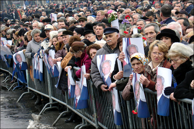 Thousands of supporters of the former Serbian president Slobodan Milosevic wait in front of the federal parliament, Belgrade, for the funeral procession where the body is to be taken to Pozarevac, his hometown, for a funeral service and burial, March 18, 2006.
