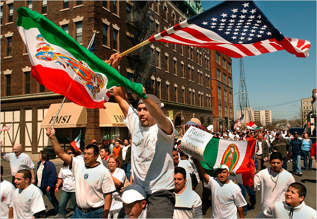 Crowds marched to protest over Congressional proposals to arrest illegal immigrants, to fortify the Mexican border and to make it a crime to give aid to illegal immigrants, Bloomington, Illinois, April 10, 2006.