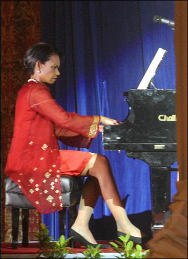 U.S. Secretary of State Condoleezza Rice plays piano at the Gala Dinner of the 39th ASEAN Ministerial Meeting, Kuala Lumpur, Malaysia, July 27, 2006.