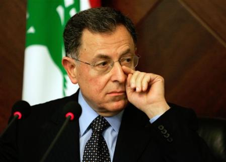 Lebanese Prime Minister Fouad AsSaniora wipes sweat from his face before starting a news conference after a Cabinet meeting, Beirut, Lebanon, August 16, 2006.