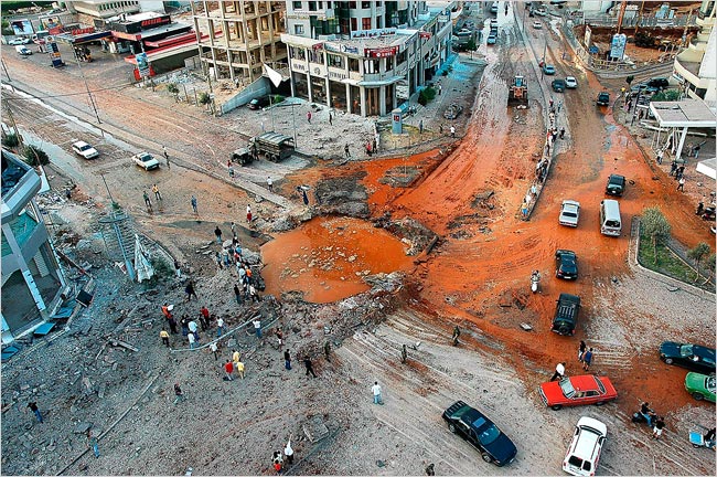 Israeli airstrikes leave a crater, Hezbollah headquarters, southern Beirut, July 14, 2006.