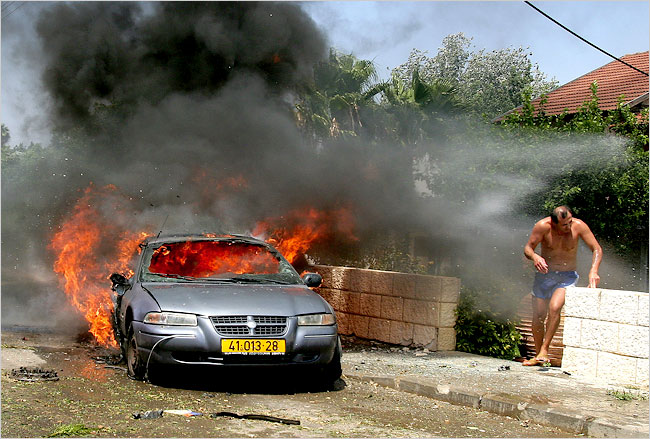 A wave of rockets fired by Hezbollah hit the town of Kiryat Shmone, near the Israel border with Lebanon, August 4, 2006.