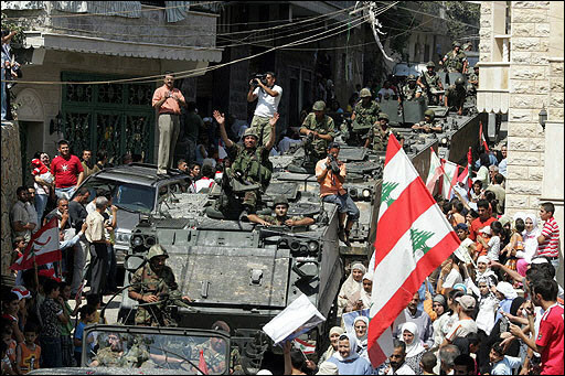 Lebanese troops are welcomed by civilians upon their arrival to the Lebanese village of Shebaa, August 18,2006.
