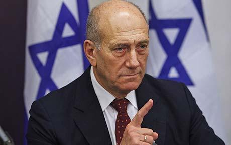 Israeli Prime Minister Ehud Olmert gestures at a press conference following a meeting of the security cabinet at the Defense Ministry, Tel Aviv, January 17, 2009.