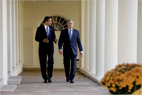 President George W. Bush and President-elect Barack Hussein Obama walk along the Colonnade before they walk through the glass doors of the Oval Office for the first of two private meetings, November 10, 2008.