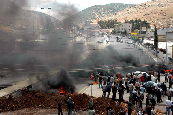 Hezbollah militia exchanges gunfire and blocks roads by burning tires,  Bekaa Valley, to the east of Beirut, May 8, 2008.