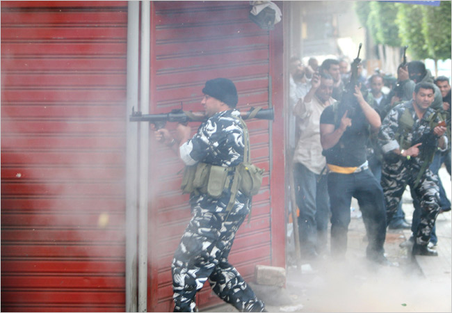 Hezbollah militants fire as attacks escalated aginst pro-government population, Beirut, May 8, 2008.