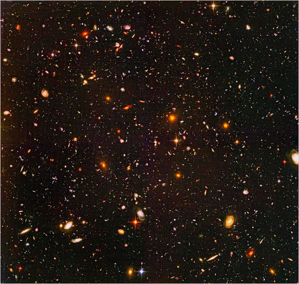 The Hubble Ultra Deep Field is the deepest image ever taken of the universe in visible light. The bright and sparkling spots are not stars but galaxies. The nearest one is about one billion light-years away.