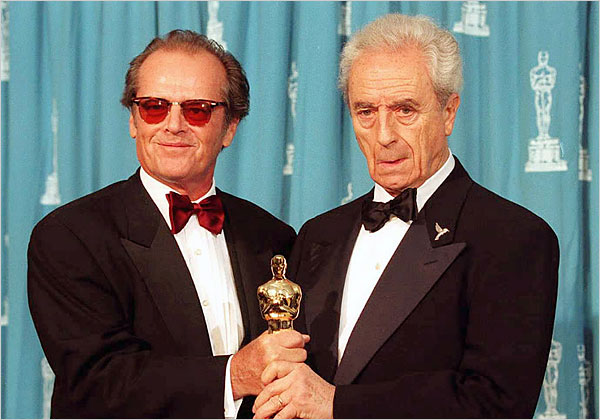 Jack Nicholson, who starred in Antonioni's 'The Passenger,' presents the director with an honorary Academy Awards, March 27, 1995.