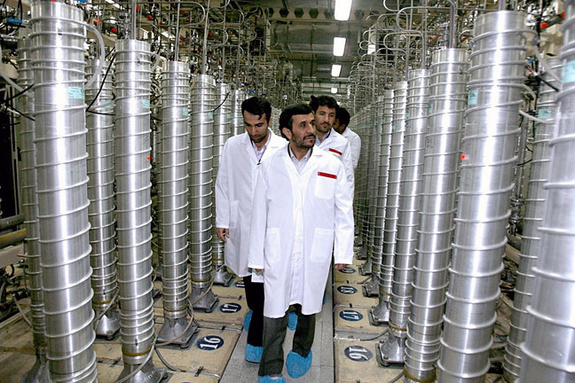 Iranian President Mahmoud Ahmadinejad tours the uranium enrichment centrifuges at Irans underground complex at Natanz, south of Tehran, April 8, 2008.
