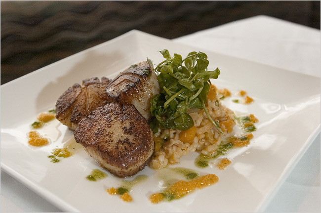 Red curry glazed sea scallops with butternut squash, carmelized onions and barley risotto prepared at Ocean, Gourmet Birmingham.