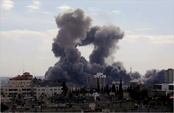 Smoke billowing from the bombs seen from Rafah as hundreds of Palestinians are also killed and scores more wounded in the first hour of Israels massive attack on about 100 Hamas sites throughout Gaza in retaliation for the recent rocket fire from the area, Gaza, December 27, 2008.