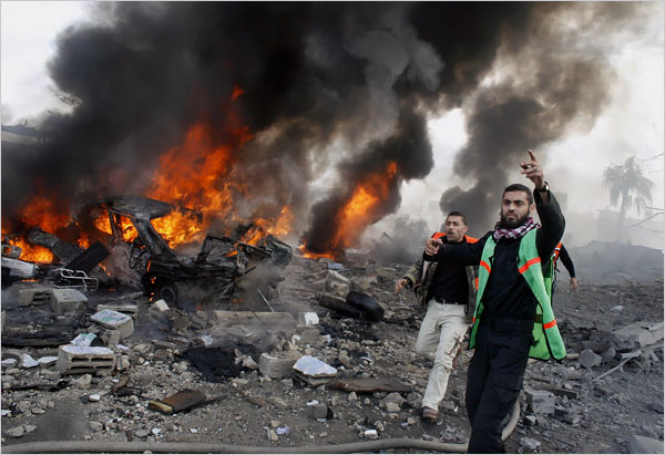 Firefighters at the site of a bombing of a Hamas security compound as hundreds of Palestinians are also killed and scores more wounded in the first hour of Israels massive attack on about 100 Hamas sites throughout Gaza in retaliation for the recent rocket fire from the area, Gaza, December 27, 2008.