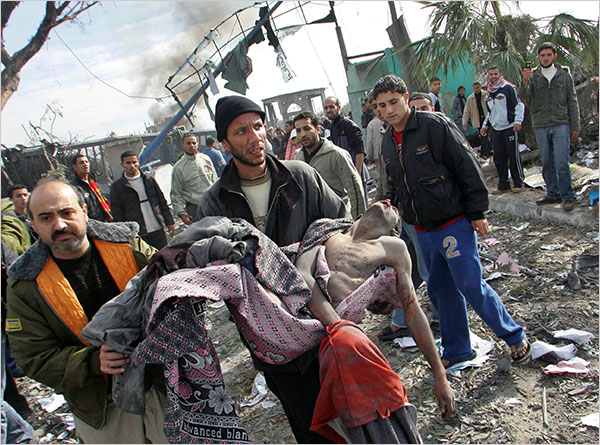 A victim of a strike on the Buriej refugee camp as hundreds of Palestinians are also killed and scores more wounded in the first hour of Israel’s massive attack on about 100 Hamas sites throughout Gaza in retaliation for the recent rocket fire from the area, Gaza, December 27, 2008.