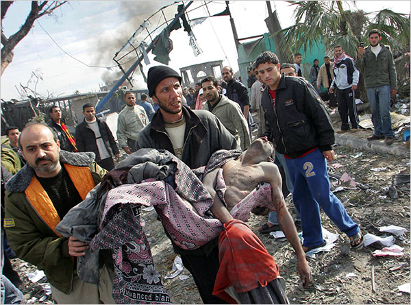 A victim of a strike on the Buriej refugee camp as hundreds of Palestinians are also killed and scores more wounded in the first hour of Israels massive attack on about 100 Hamas sites throughout Gaza in retaliation for the recent rocket fire from the area, Gaza, December 27, 2008.