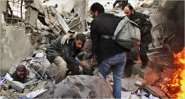 On the second day of Israels massive attack on Hamas sites throughout Gaza in retaliation for the recent rocket fire from the area, Palestinian rescue workers help a wounded prisoner after an Israeli missile attack at the main security compound and prison, the Saraya, December 28, 2008.