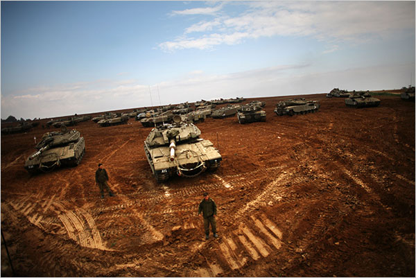 On the second day of Israels massive attack on Hamas sites throughout Gaza in retaliation for the recent rocket fire from the area, Israeli troops and tanks mass along the Gaza border and the government said it had called up reserves for a possible ground operation, December 28, 2008.