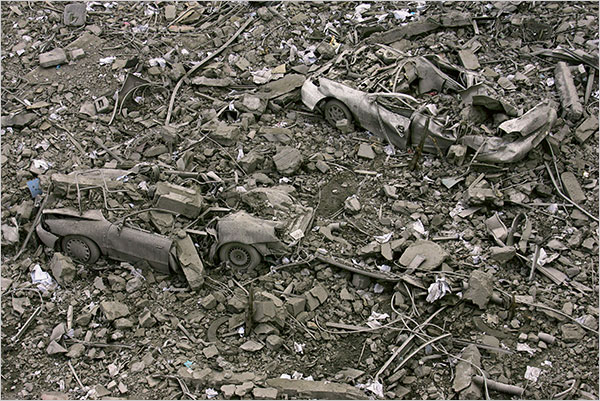On the fourth day of Israels massive attack on Hamas sites throughout Gaza in retaliation for the recent rocket fire from the area, cars buried under rubble at the site of the compound buildings linked to the Islamic University, the home of a top Hamas commander, Gaza City, December 30, 2008.